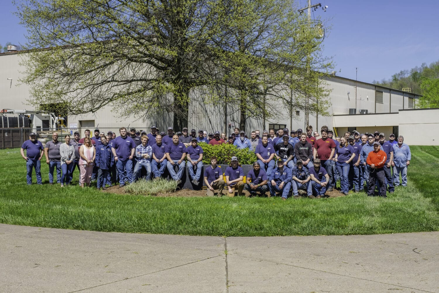 Hi-Vac Corporation manufacturing team posed outside the Marietta, Ohio facility